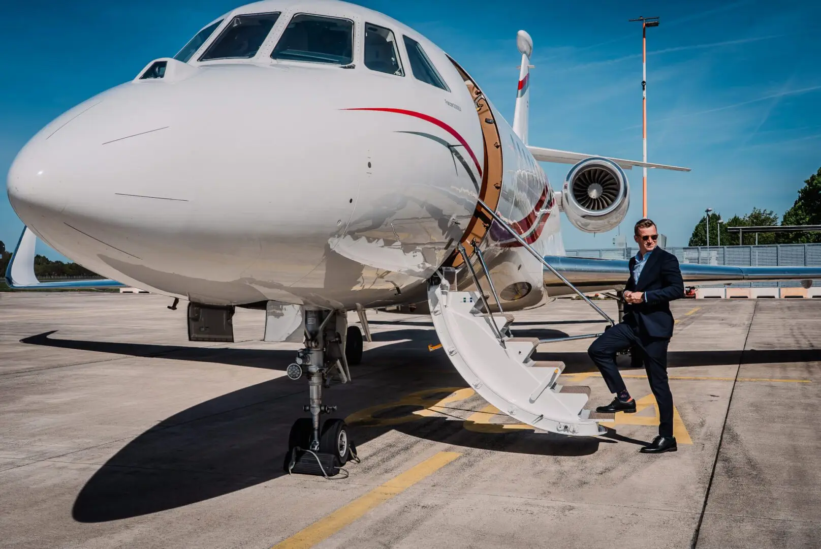 SwiftWings client boarding private jet with assistance from dedicated crew